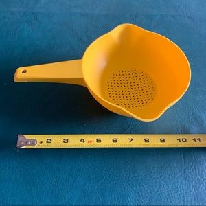Vintage small yellow Tupperware strainer